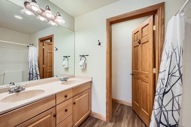 22714 US Highway 6 Unit 5945, Keystone, CO 80435 - full bathroom with wood finished floors, double vanity, and a shower with curtain