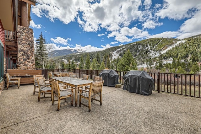 22714 US Highway 6 Unit 5945, Keystone, CO 80435 - view of patio with a mountain view, a grill, and outdoor dining space
