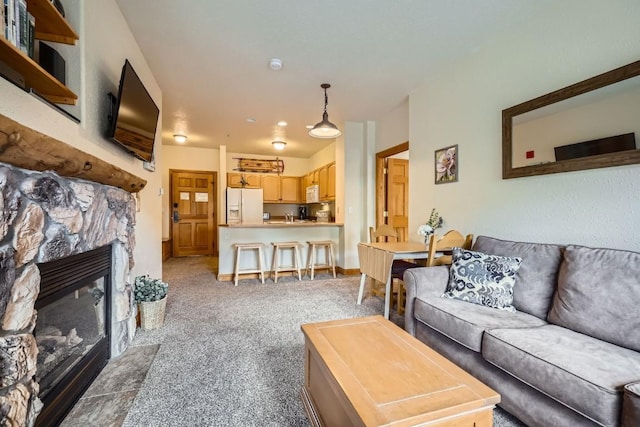 22714 US Highway 6 Unit 5945, Keystone, CO 80435 - carpeted living room with a fireplace