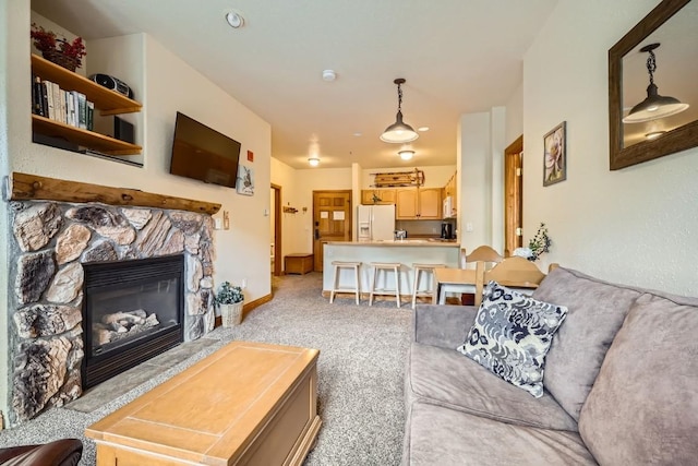 22714 US Highway 6 Unit 5945, Keystone, CO 80435 - living room featuring light carpet and a fireplace