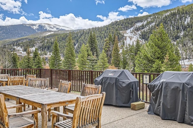 22714 US Highway 6 Unit 5945, Keystone, CO 80435 - view of patio with a mountain view, a forest view, outdoor dining space, and grilling area