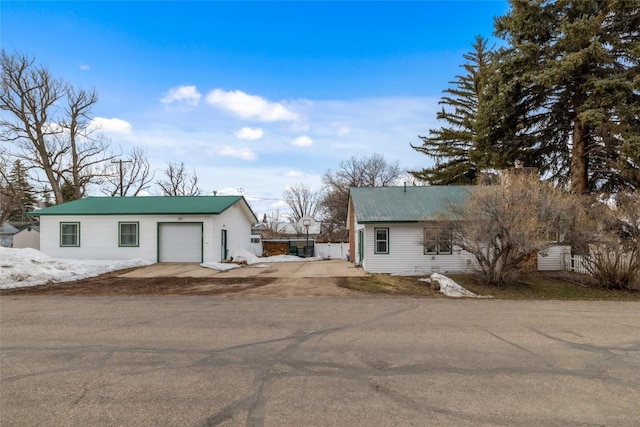 399 E Jefferson Ave, Hayden, CO 81639 - view of front of house featuring metal roof, a garage, and an outdoor structure