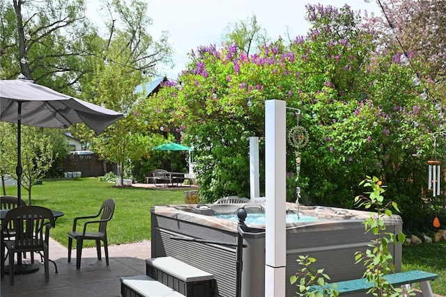 399 E Jefferson Ave, Hayden, CO 81639 - wooden terrace featuring a hot tub, a patio area, and a lawn