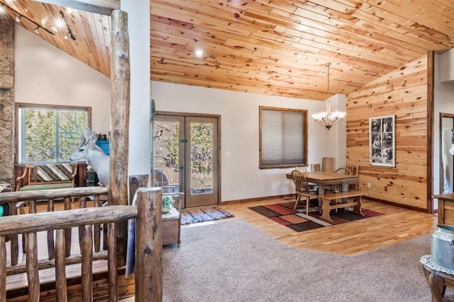 3692 County Road 7, Craig, CO 81625 - living room with wood ceiling, a chandelier, wood finished floors, baseboards, and high vaulted ceiling