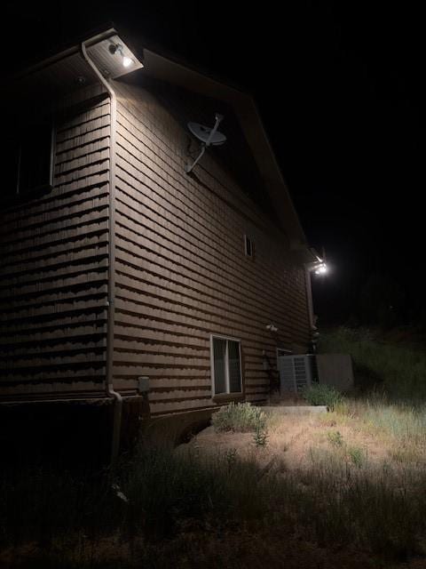 3692 County Road 7, Craig, CO 81625 - property exterior at twilight featuring a central AC unit