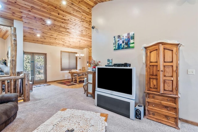 3692 County Road 7, Craig, CO 81625 - carpeted living area featuring lofted ceiling, wooden ceiling, recessed lighting, a chandelier, and french doors