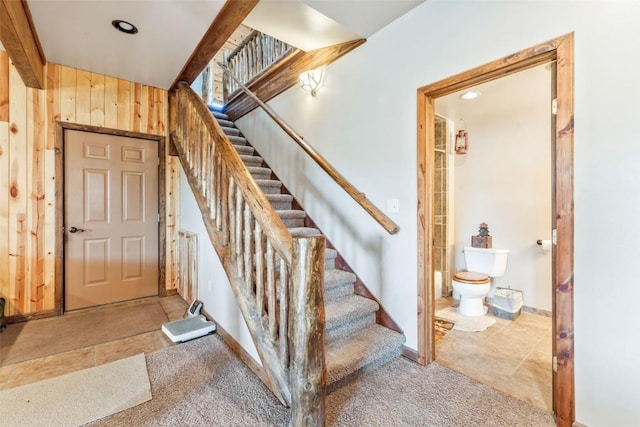 3692 County Road 7, Craig, CO 81625 - carpeted entrance foyer with stairway, baseboards, wood walls, recessed lighting, and tile patterned floors