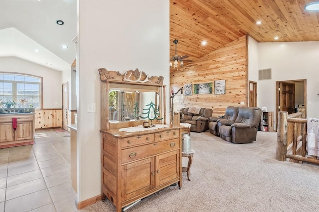 3692 County Road 7, Craig, CO 81625 - living area with high vaulted ceiling, light carpet, recessed lighting, wood walls, and wood ceiling