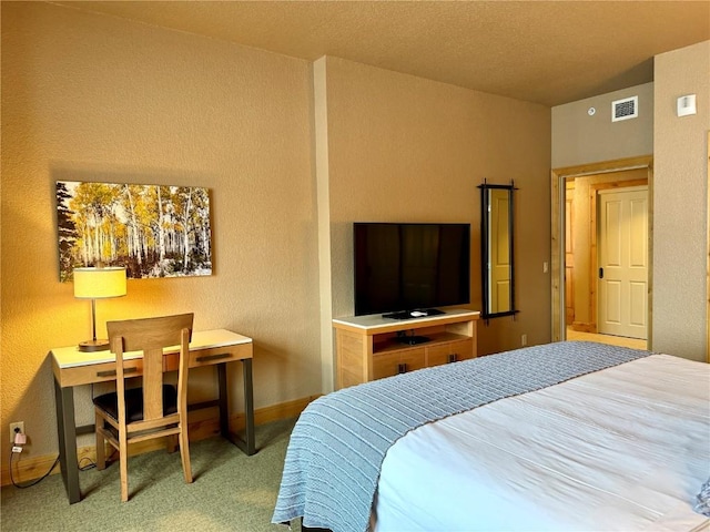 2300 Mount Werner Cir Unit 322, Steamboat Springs, CO 80487 - bedroom with carpet, a textured wall, and baseboards
