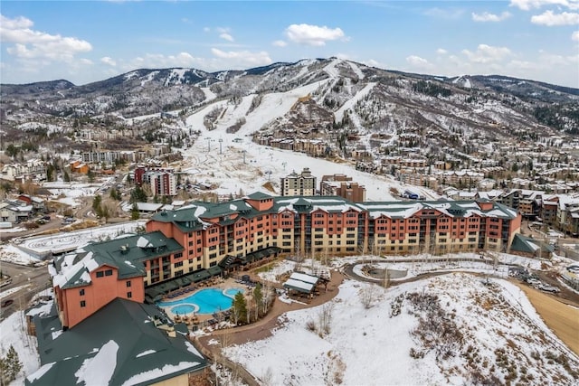 2300 Mount Werner Cir Unit 322, Steamboat Springs, CO 80487 - snowy aerial view featuring a mountain view and view of pool