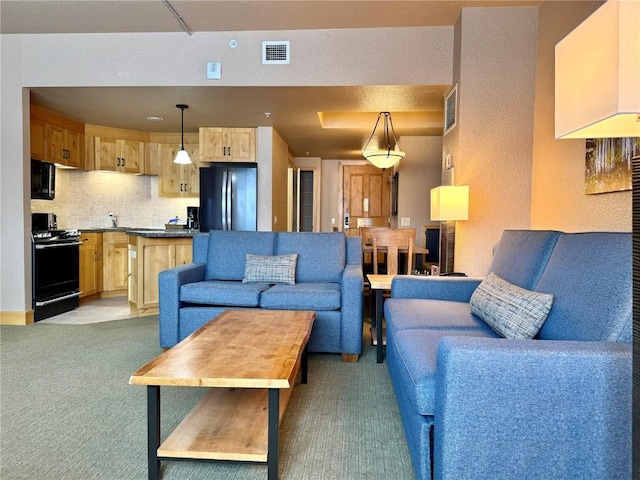 living room with carpet floors and visible vents