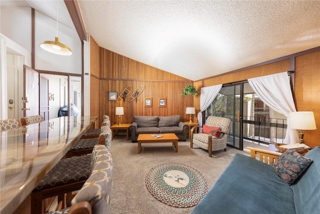 1173 Ski Hill Rd Unit 131, Breckenridge, CO 80424 - living room with carpet floors, lofted ceiling, a textured ceiling, and wooden walls