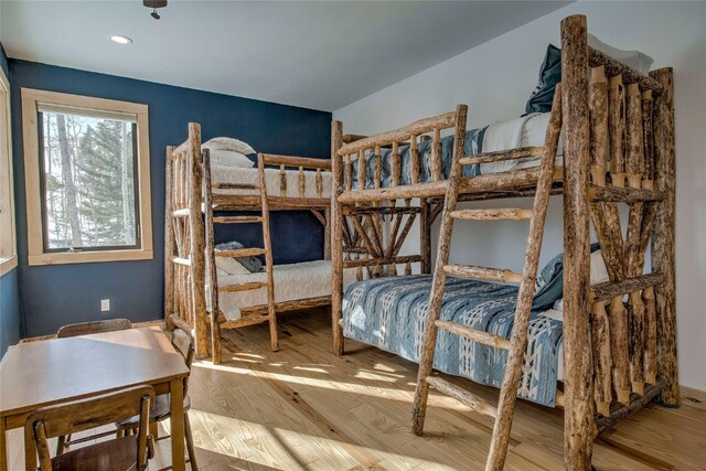 bedroom featuring recessed lighting and wood finished floors