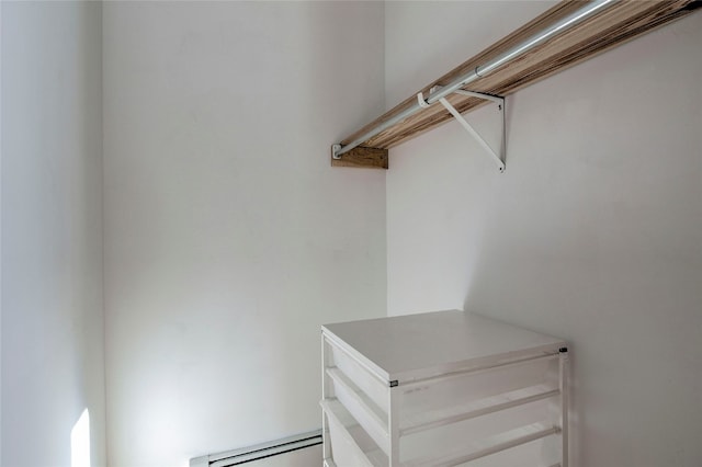 spacious closet with a baseboard radiator