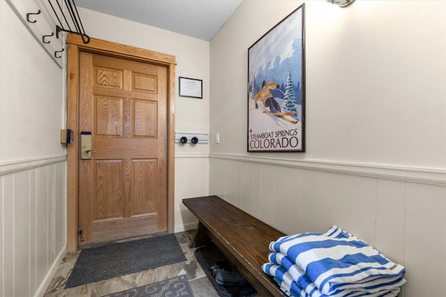 2350 Ski Trail Ln Unit 313, Steamboat Springs, CO 80487 - mudroom featuring a wainscoted wall and a decorative wall