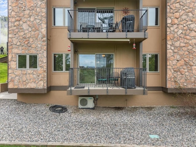 2350 Ski Trail Ln Unit 313, Steamboat Springs, CO 80487 - back of property with a balcony and a cooling unit