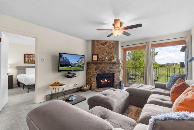 2350 Ski Trail Ln Unit 313, Steamboat Springs, CO 80487 - living area with carpet floors, a ceiling fan, a fireplace, and baseboards