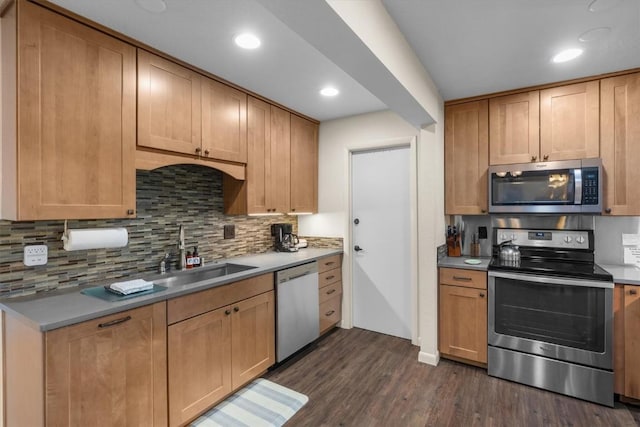 2350 Ski Trail Ln Unit 313, Steamboat Springs, CO 80487 - kitchen with appliances with stainless steel finishes, a sink, dark wood-style floors, backsplash, and recessed lighting