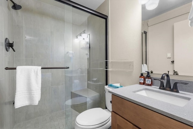 2350 Ski Trail Ln Unit 313, Steamboat Springs, CO 80487 - bathroom featuring vanity, toilet, and a shower stall