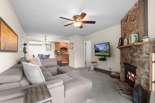 2350 Ski Trail Ln Unit 313, Steamboat Springs, CO 80487 - living room featuring carpet, a ceiling fan, a stone fireplace, and a wall mounted AC