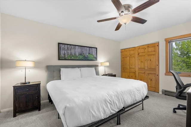 2350 Ski Trail Ln Unit 313, Steamboat Springs, CO 80487 - bedroom featuring light carpet, a closet, baseboards, and ceiling fan