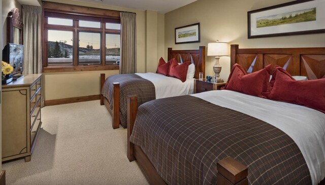 2250 Apres Ski Way Unit R-702, Steamboat Springs, CO 80487 - bedroom featuring light colored carpet and baseboards