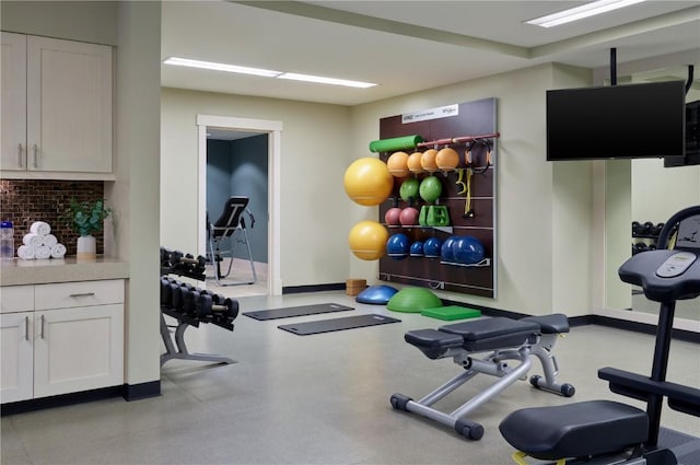 exercise room with baseboards
