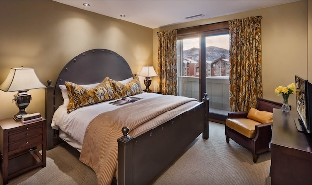 carpeted bedroom with visible vents, recessed lighting, and access to exterior