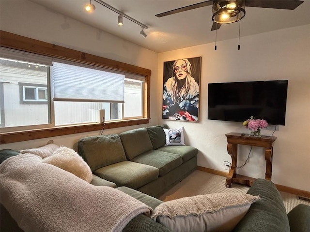 1325 Dream Island Plz Unit 55, Steamboat Springs, CO 80487 - carpeted living room with rail lighting and ceiling fan