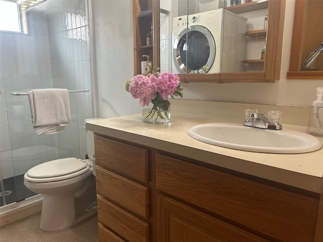 1325 Dream Island Plz Unit 55, Steamboat Springs, CO 80487 - bathroom featuring washer / dryer, vanity, and a stall shower