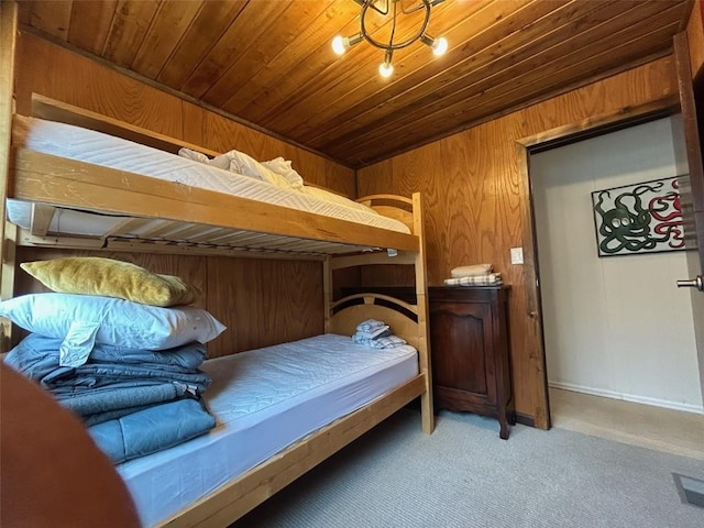 1325 Dream Island Plz Unit 55, Steamboat Springs, CO 80487 - carpeted bedroom featuring wooden walls and wood ceiling