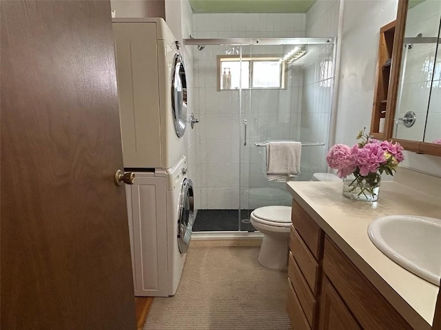 1325 Dream Island Plz Unit 55, Steamboat Springs, CO 80487 - bathroom with estacked washer and dryer, vanity, and a shower stall