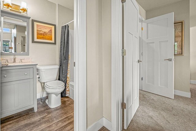 1800 Burgess Creek Rd SW Unit 209, Steamboat Springs, CO 80487 - full bath with vanity, toilet, baseboards, and shower / bath combo