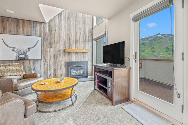 1800 Burgess Creek Rd SW Unit 209, Steamboat Springs, CO 80487 - living room featuring carpet, a fireplace, and baseboards