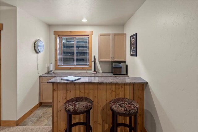 46 Sage View Ct, Dillon, CO 80435 - bar featuring stone finish flooring and baseboards