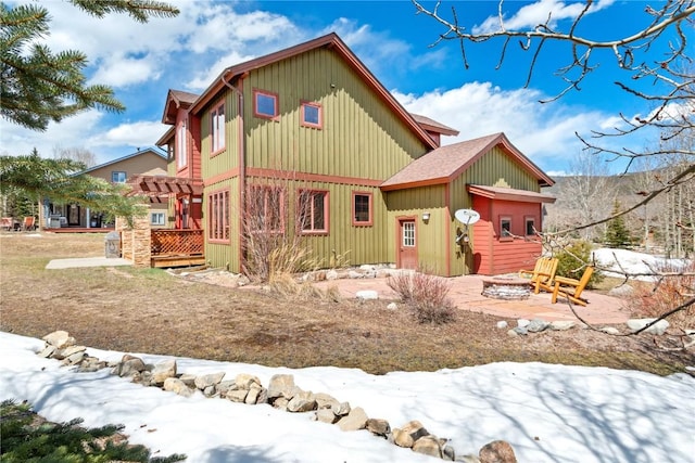 46 Sage View Ct, Dillon, CO 80435 - view of front of house with board and batten siding and an outdoor fire pit