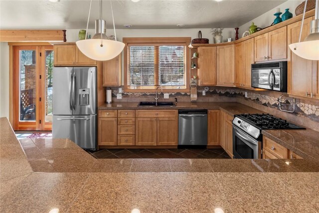 46 Sage View Ct, Dillon, CO 80435 - kitchen with stainless steel appliances, tile counters, a sink, and a wealth of natural light