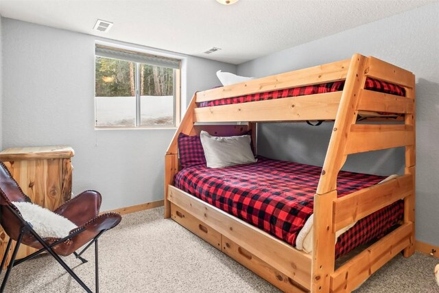 407 S Puma Pl, Fairplay, CO 80440 - carpeted bedroom featuring baseboards and visible vents