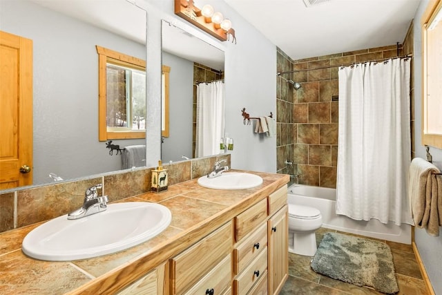 407 S Puma Pl, Fairplay, CO 80440 - full bathroom featuring shower / bath combination with curtain, double vanity, toilet, and a sink