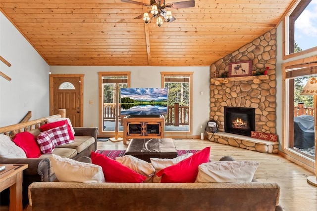 407 S Puma Pl, Fairplay, CO 80440 - living area with ceiling fan, vaulted ceiling, a healthy amount of sunlight, and a fireplace