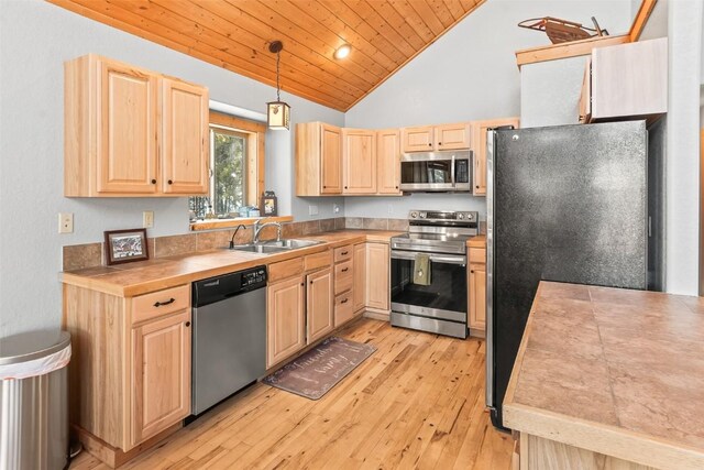 407 S Puma Pl, Fairplay, CO 80440 - kitchen featuring light brown cabinets, a sink, light wood-type flooring, wood ceiling, and stainless steel appliances