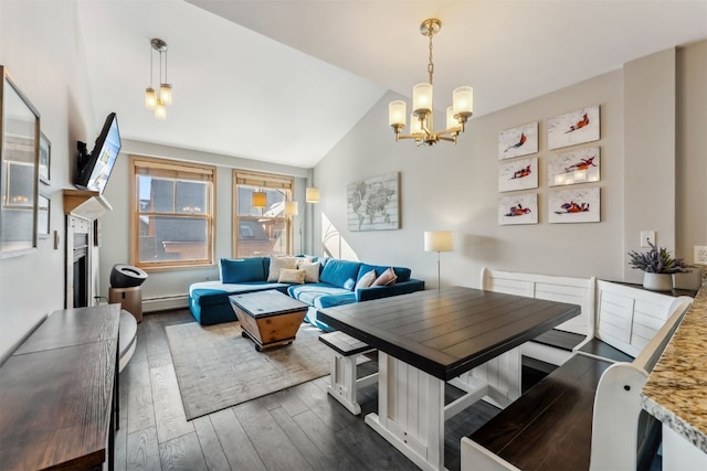 140 Ida Belle Dr Unit 8292, Keystone, CO 80435 - living room with a baseboard radiator, vaulted ceiling, dark wood-style floors, and a notable chandelier