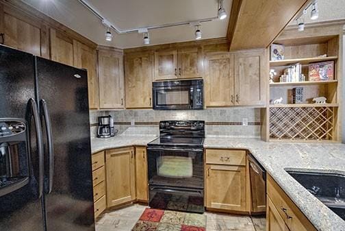 765 Columbine Rd Unit C103, Breckenridge, CO 80424 - kitchen featuring black appliances, track lighting, light countertops, tasteful backsplash, and a sink
