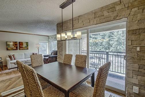 765 Columbine Rd Unit C103, Breckenridge, CO 80424 - dining space featuring a textured ceiling and wood finished floors