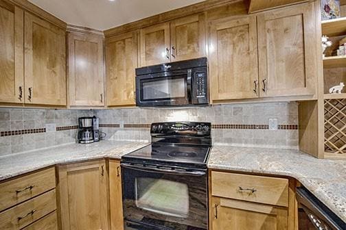 765 Columbine Rd Unit C103, Breckenridge, CO 80424 - kitchen featuring black appliances, backsplash, and light stone counters
