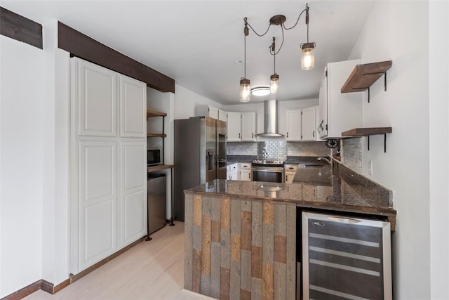 272 Doris Dr, Breckenridge, CO 80424 - kitchen featuring open shelves, wine cooler, stainless steel appliances, and wall chimney range hood