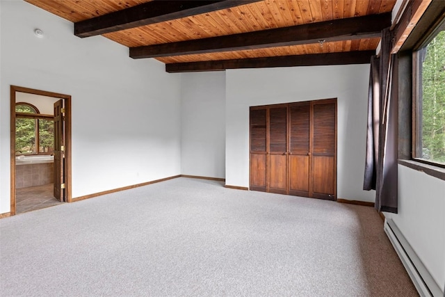 272 Doris Dr, Breckenridge, CO 80424 - empty room with a baseboard radiator, light colored carpet, wooden ceiling with exposed beams, and baseboards