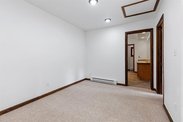 272 Doris Dr, Breckenridge, CO 80424 - unfurnished room featuring a baseboard heating unit, attic access, light colored carpet, baseboards, and recessed lighting