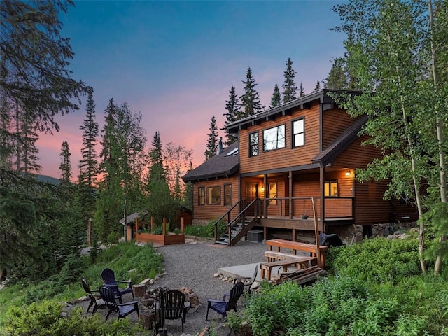 272 Doris Dr, Breckenridge, CO 80424 - rear view of house with a fire pit, stairway, a patio area, and covered porch