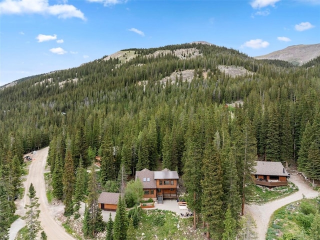 272 Doris Dr, Breckenridge, CO 80424 - aerial overview of property's location featuring a forest and a mountainous background